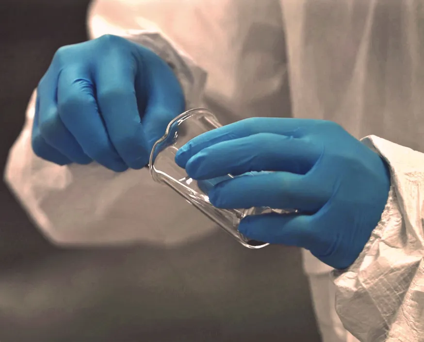 Hands while mixing chemicals